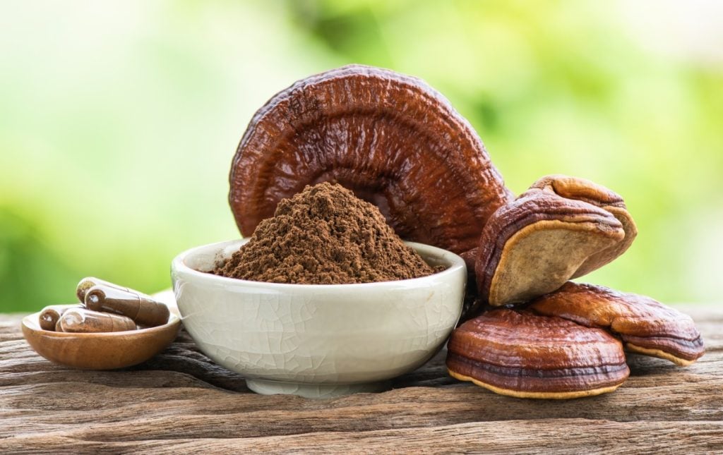 Reishi mushrooms, powder and capsules.