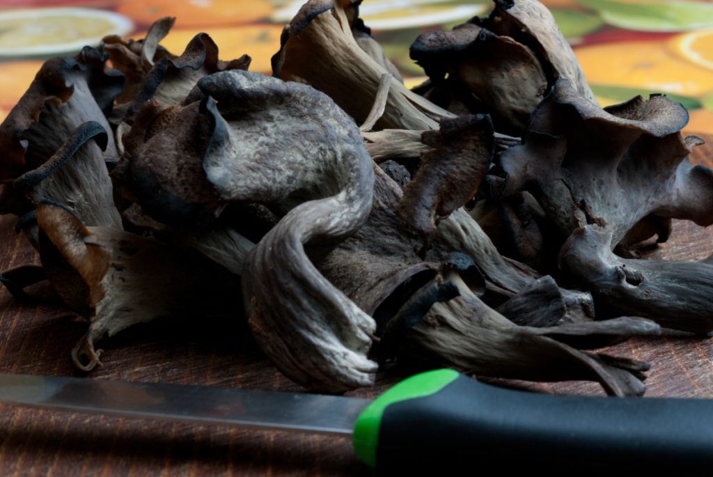 Cleaning and chopping black trumpet mushrooms