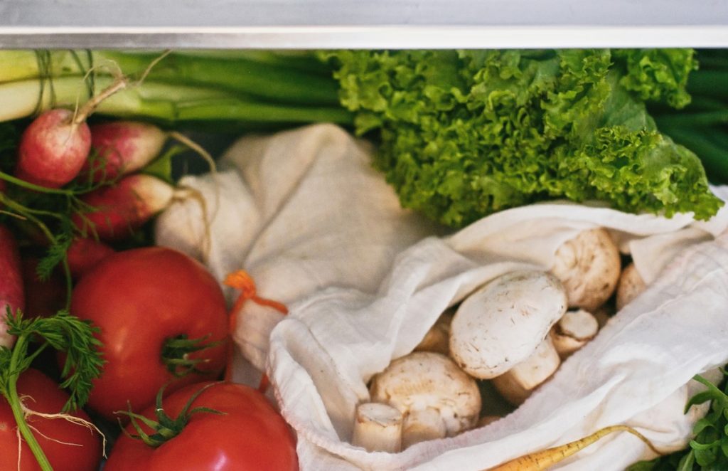 Mushrooms in a cloth bag in the fridge.