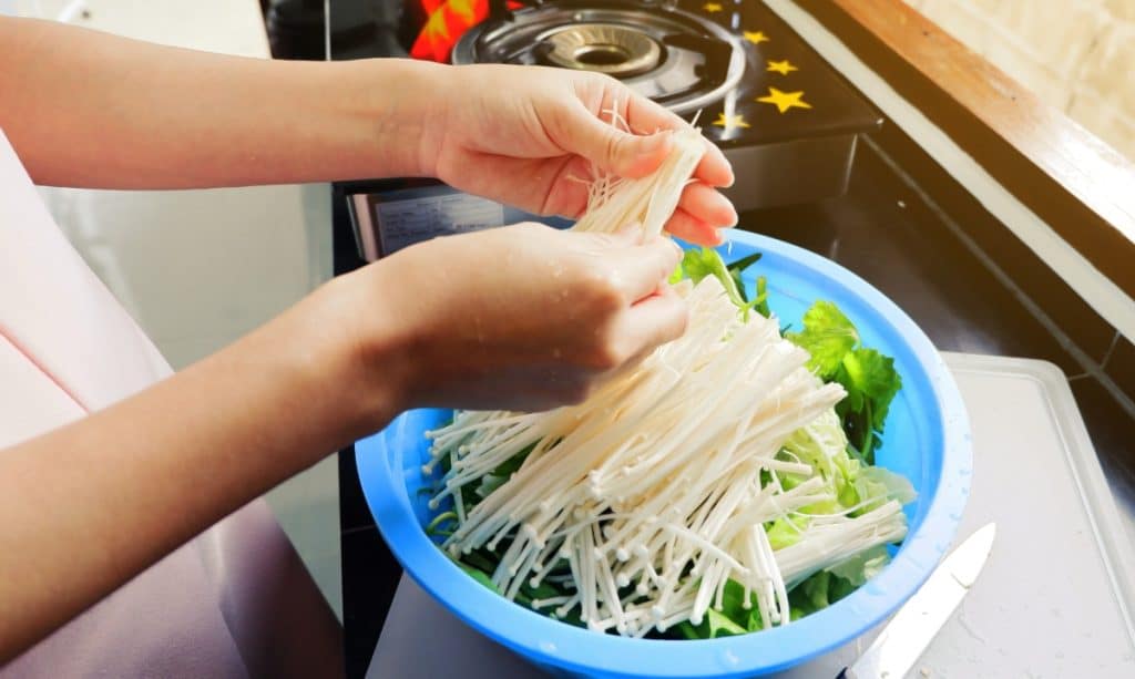 Raw enoki mushrooms for a salad